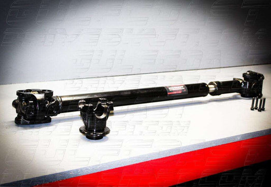 Front driveshaft for 2018+ Jeep JL Wrangler, featuring black steel construction, solid U-joints, and various fittings.